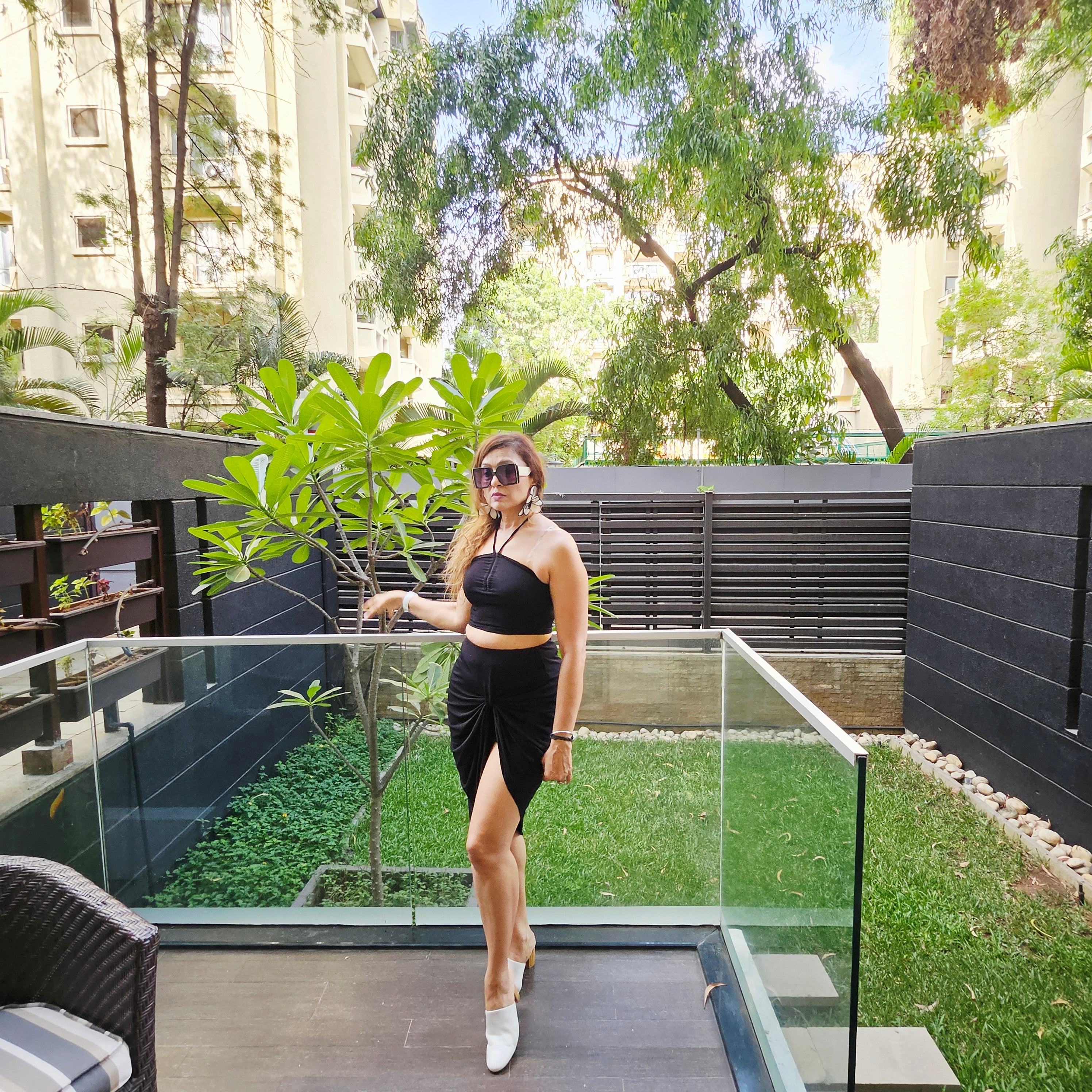 Full look all-black ruched crop and front knot skirt co-ord for women
