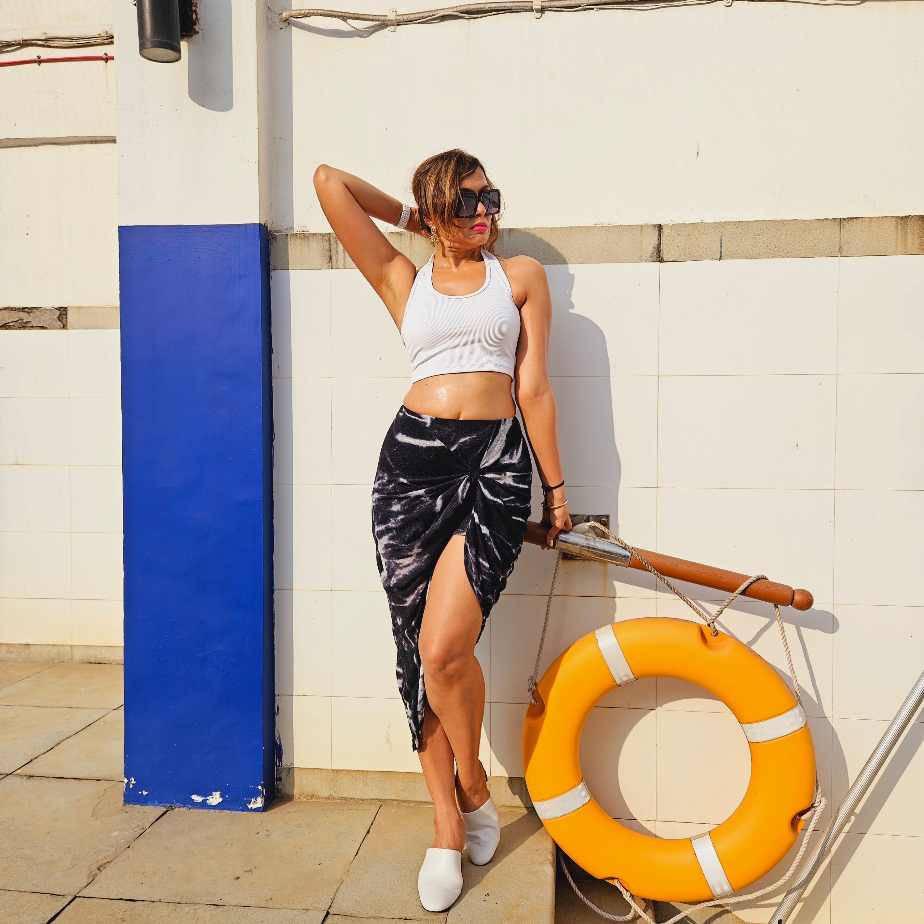 black long skirt: Black Wavy Knot Long Skirt (walking shot)
