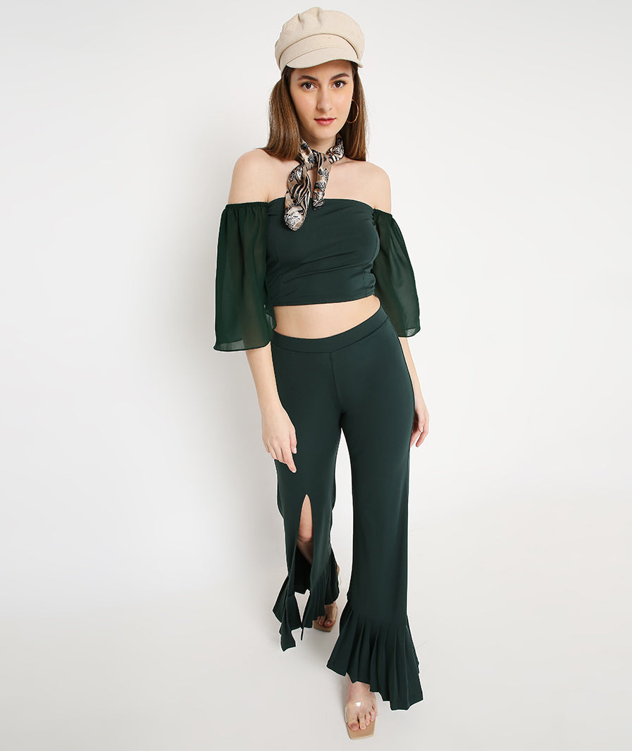 Sleeve movement on green bell sleeve co-ord pants set for women

