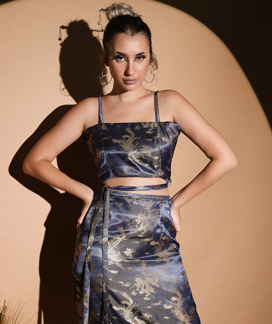 Dragon motif detail on grey satin co-ord top and skirt – Marcel & Mae
