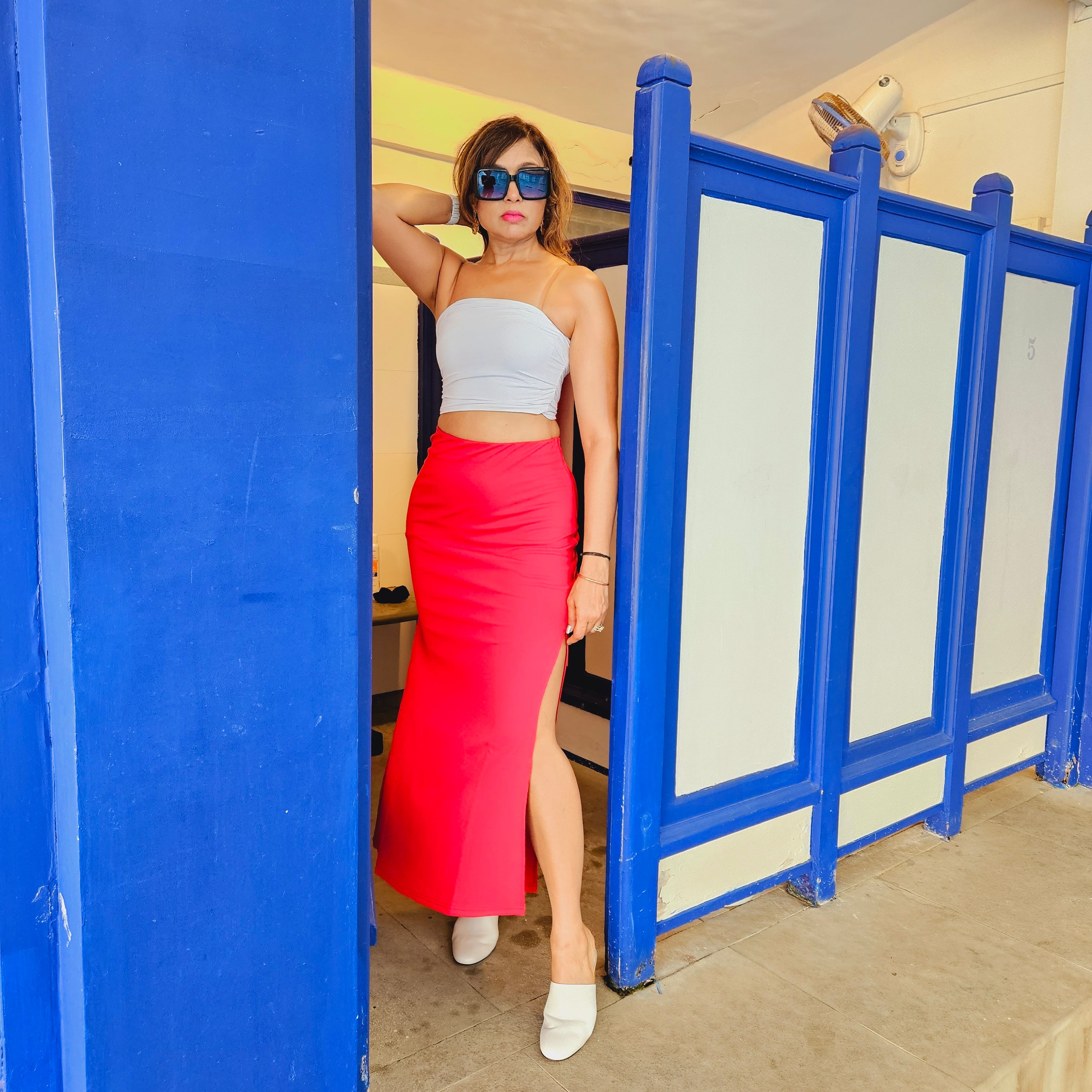 Red Cocktail Slit Skirt and Side Zip styled for party and vacation – seated pose
