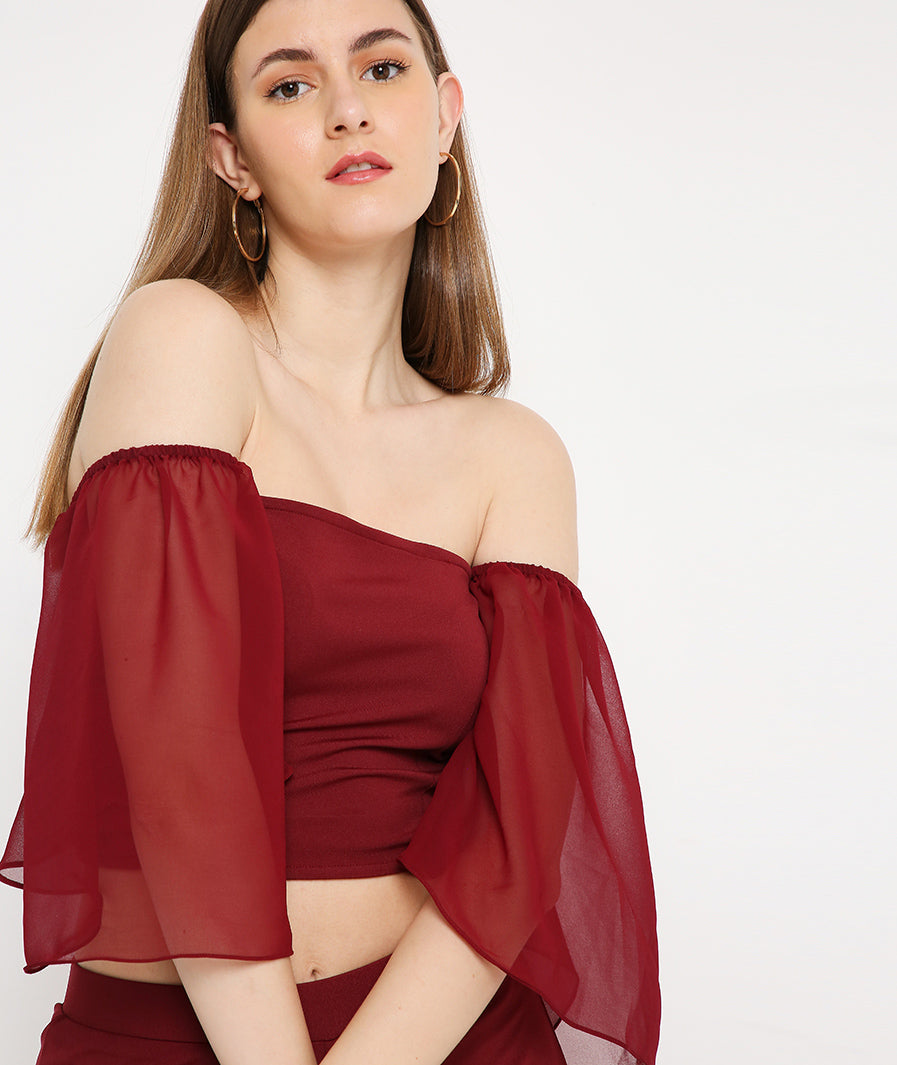 Sleeve movement on red bell sleeve co-ord pants set for women
