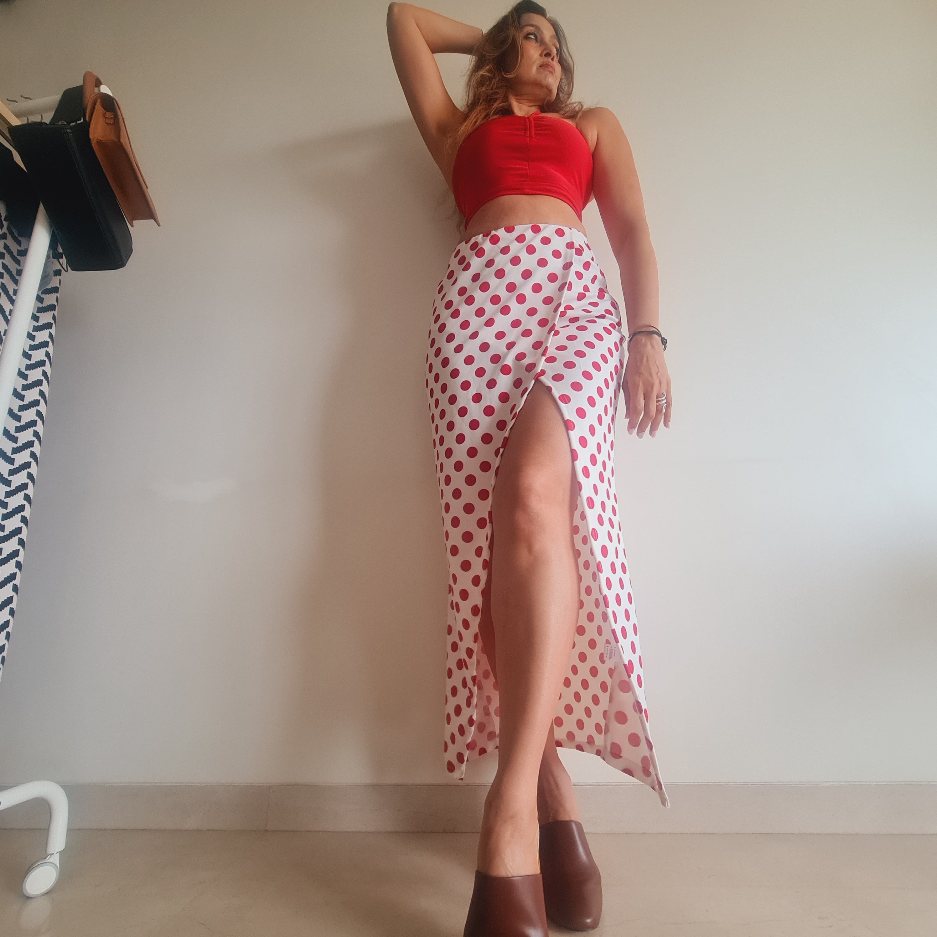 Red Polka Wraparound Long Skirt styled for party and vacation – slit movement shot
