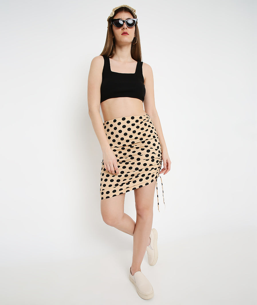 Cream Polka Drawstring Mini Skirt styled for party and vacation – texture close-up
