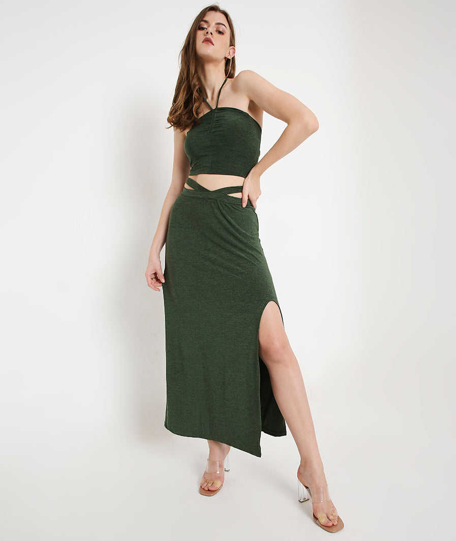 Marcel & Mae Green Long Skirt with Side Cut-Out and Front Slit, seated pose, green long skirt
