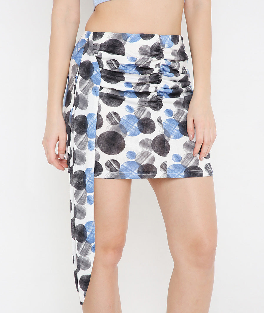 Marcel & Mae Sash Mini Skirt with Large Circles, slit movement shot, statement mini skirt
